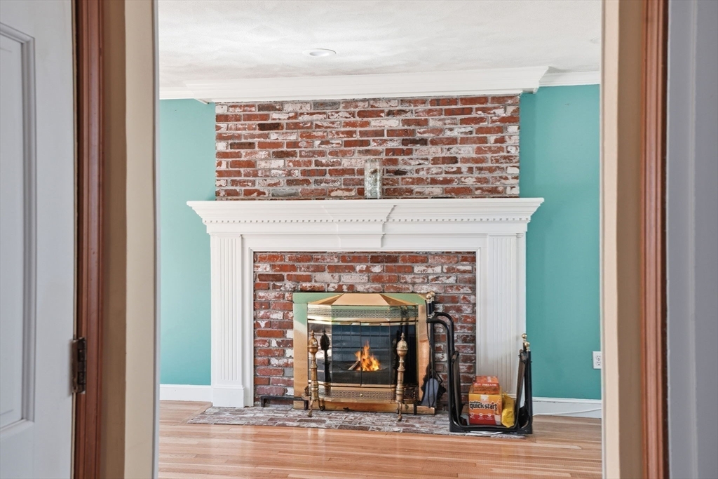 3 Fairway Drive Canton, MA 02021 - Photo 11 of 34 a view of an empty room with a fireplace