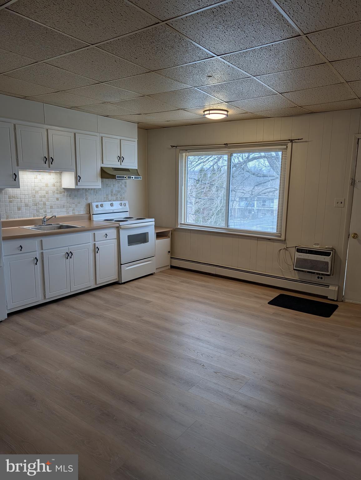 238 Main Street, Unit 3 Hellertown, PA 18055 - Photo 2 of 8 a room with granite countertop furniture and a window