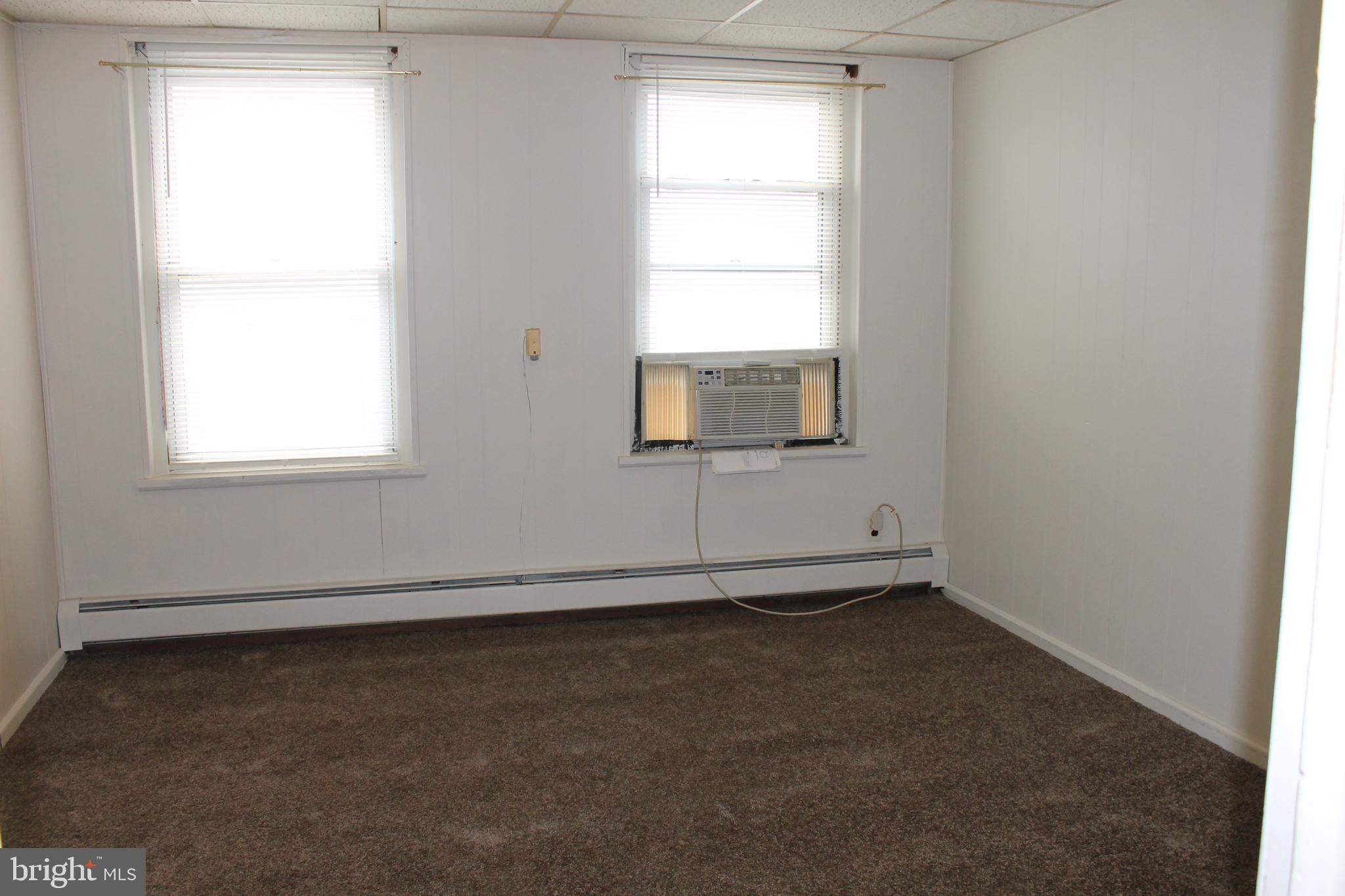 238 Main Street, Unit 3 Hellertown, PA 18055 - Photo 7 of 8 an empty room with a window