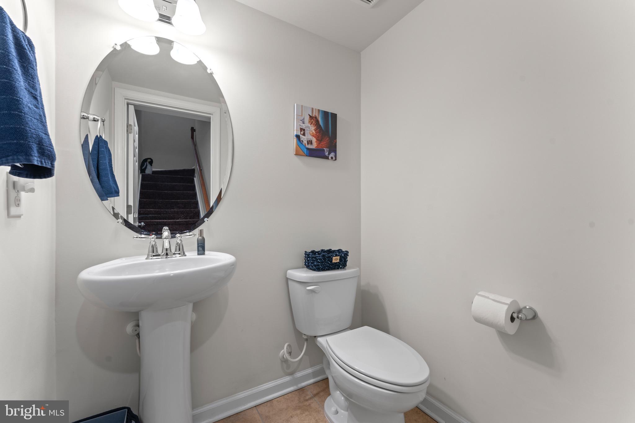 484 Rowan Street Warminster, PA 18974 - Photo 20 of 37 a bathroom with a toilet sink and mirror