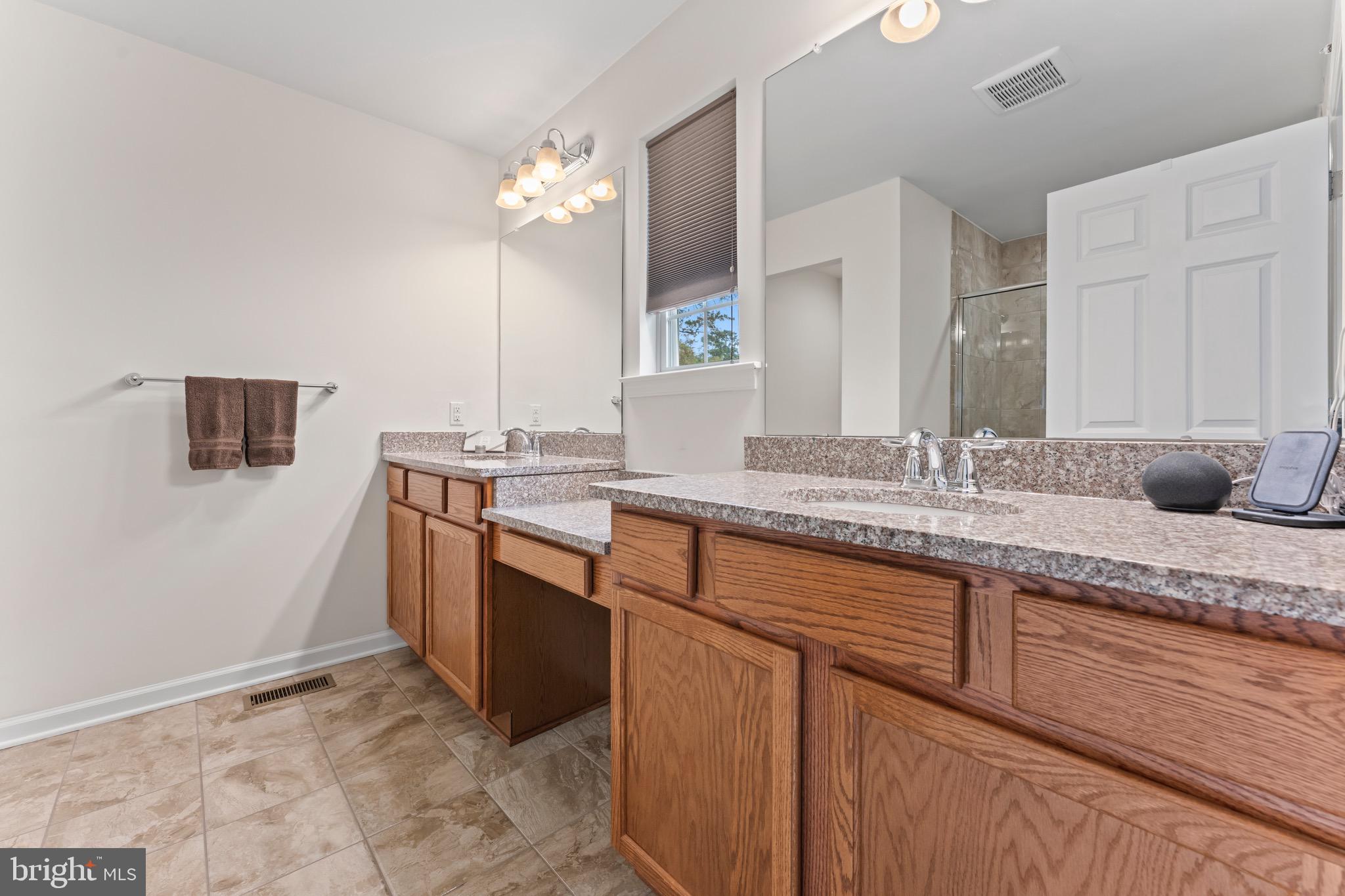 484 Rowan Street Warminster, PA 18974 - Photo 24 of 37 a bathroom with a sink and a mirror