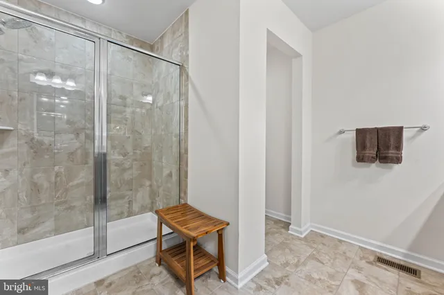 a bathroom with a shower and a toilet