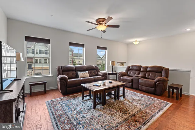 a living room with furniture and a rug