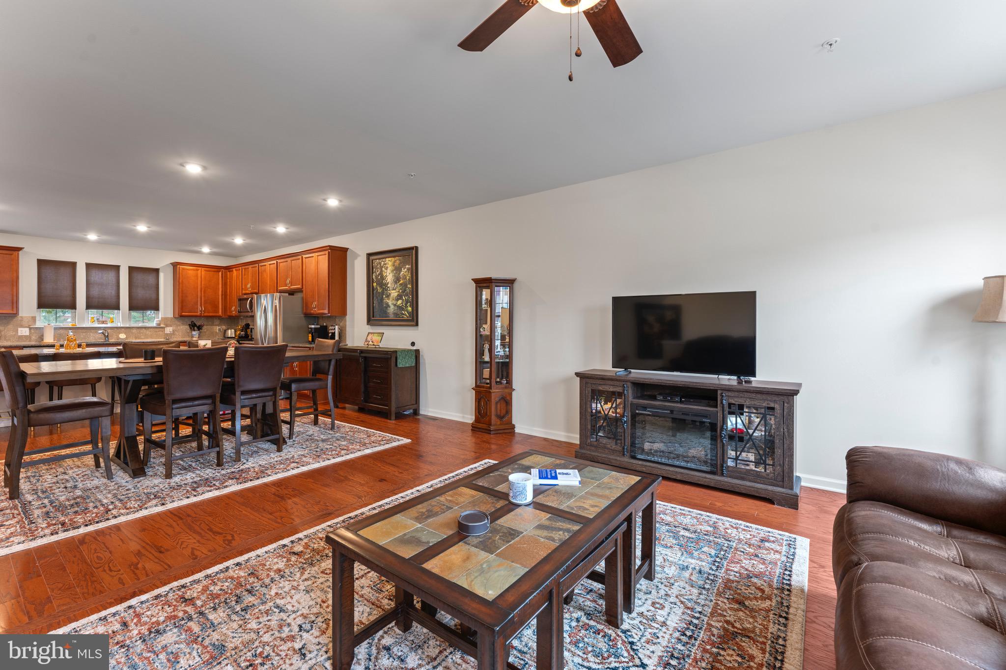 484 Rowan Street Warminster, PA 18974 - Photo 8 of 37 a living room with furniture kitchen view and a flat screen tv