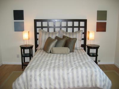 471 Live Oak Drive Mill Valley, CA 94941 - Photo 10 of 11 a large bed sitting in a bedroom next to a window with chair