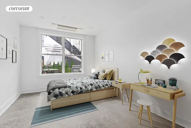 a bedroom with a bed and a window