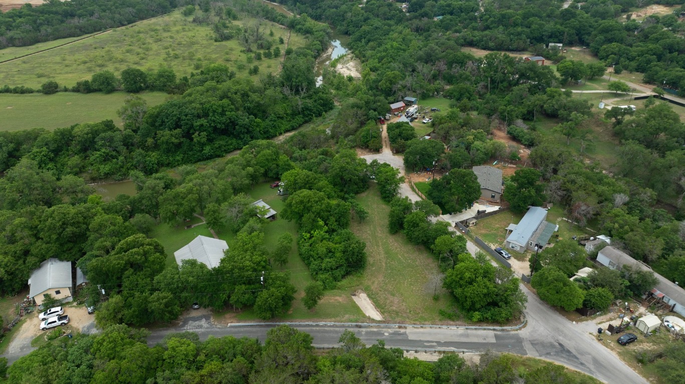 101 River Road Liberty Hill, TX 78642 - Photo 12 of 21 an aerial view of residential houses with outdoor space and trees
