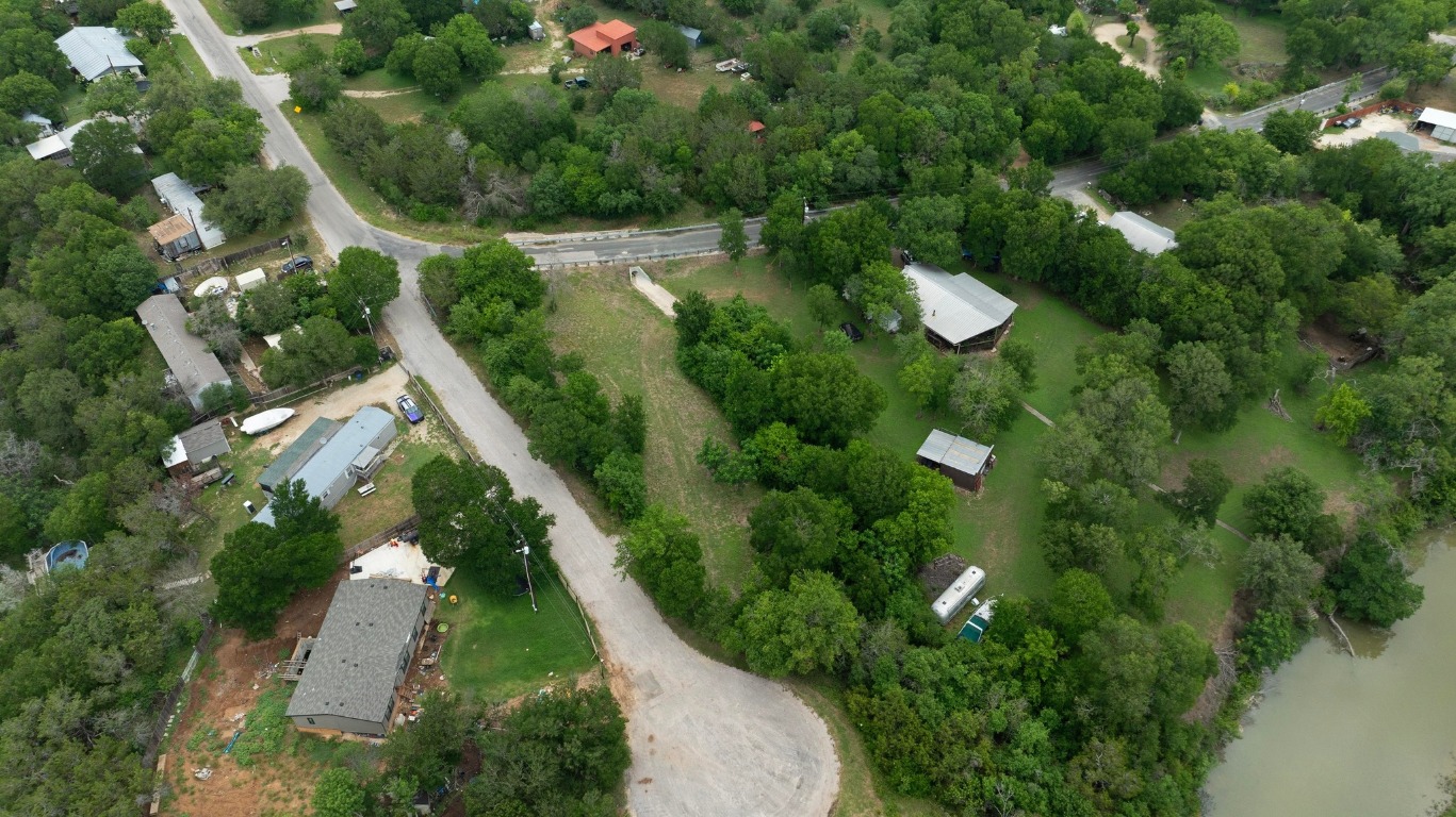 101 River Road Liberty Hill, TX 78642 - Photo 15 of 21 an aerial view of residential houses with outdoor space and trees