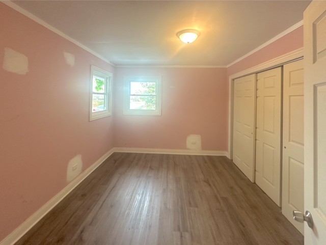 17833 Harwood Avenue Homewood, IL 60430 - Photo 8 of 12 a view of an empty room with wooden floor and a window
