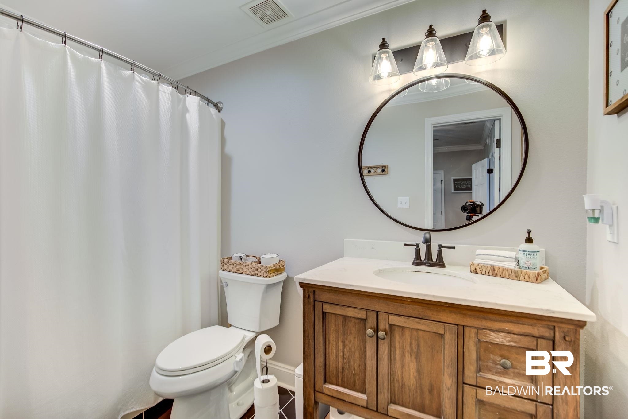 18732 Fairground Road Robertsdale, AL 36567 - Photo 26 of 46 Bathroom with vanity, crown molding, and toilet