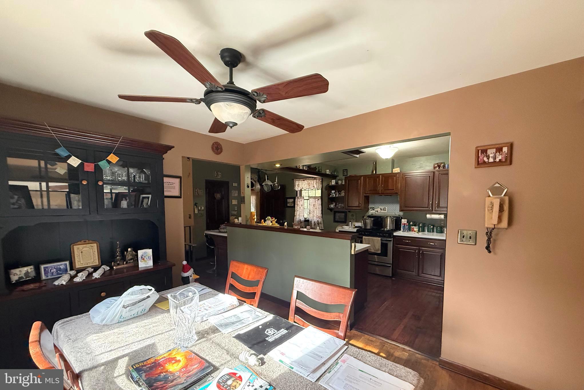 1545 East Buckshutem Road Millville, NJ 08332 - Photo 18 of 41 a living room with furniture and a chandelier