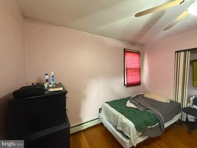 a bedroom with a bed and dresser