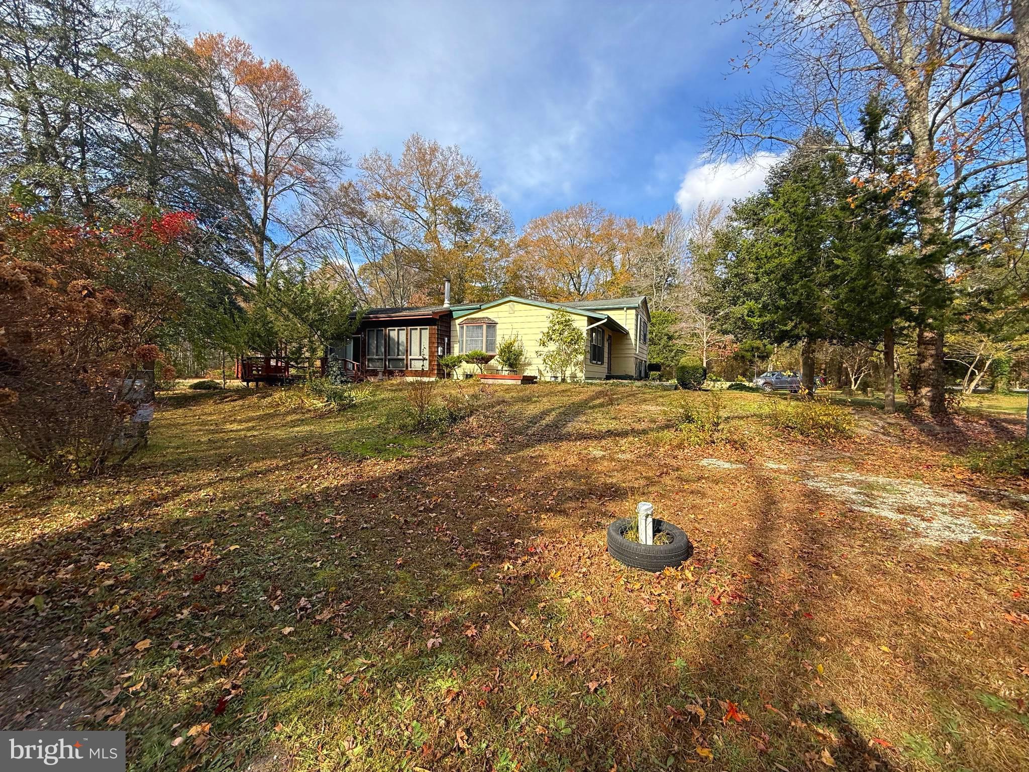 1545 East Buckshutem Road Millville, NJ 08332 - Photo 39 of 41 a view of a yard with yellow lighting