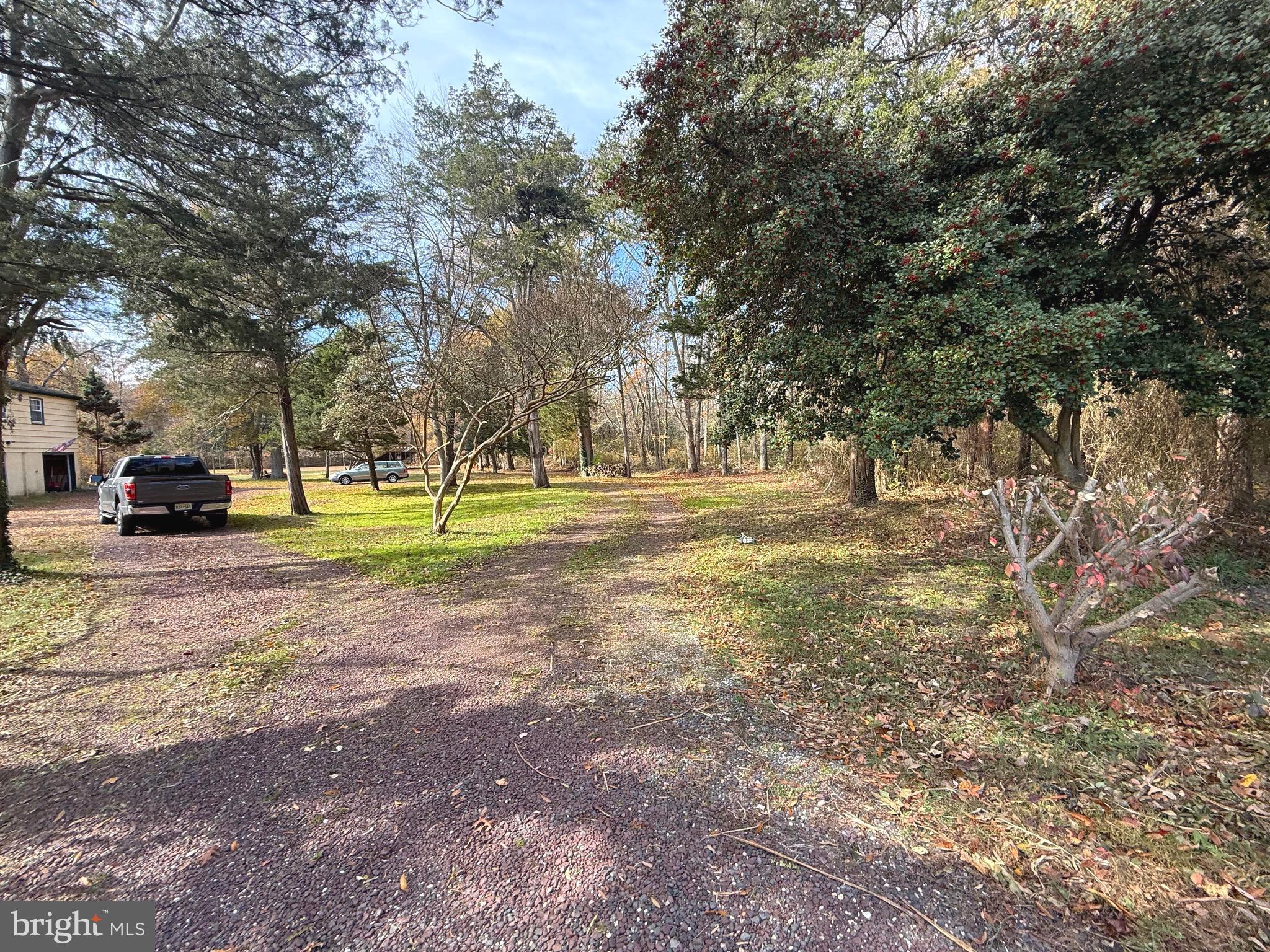 1545 East Buckshutem Road Millville, NJ 08332 - Photo 41 of 41 a view of road with trees