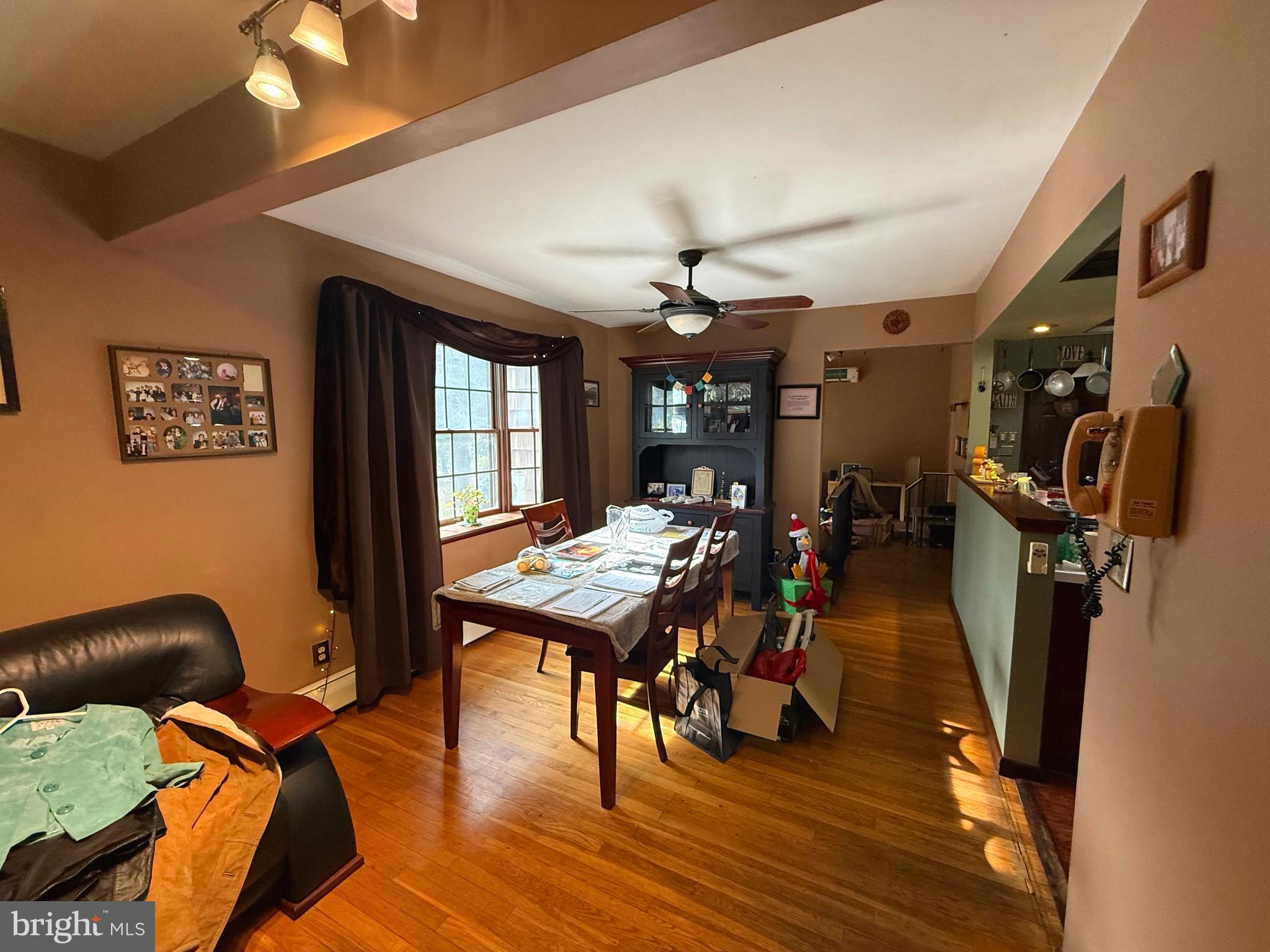 1545 East Buckshutem Road Millville, NJ 08332 - Photo 10 of 41 a view of a livingroom with furniture window and wooden floor