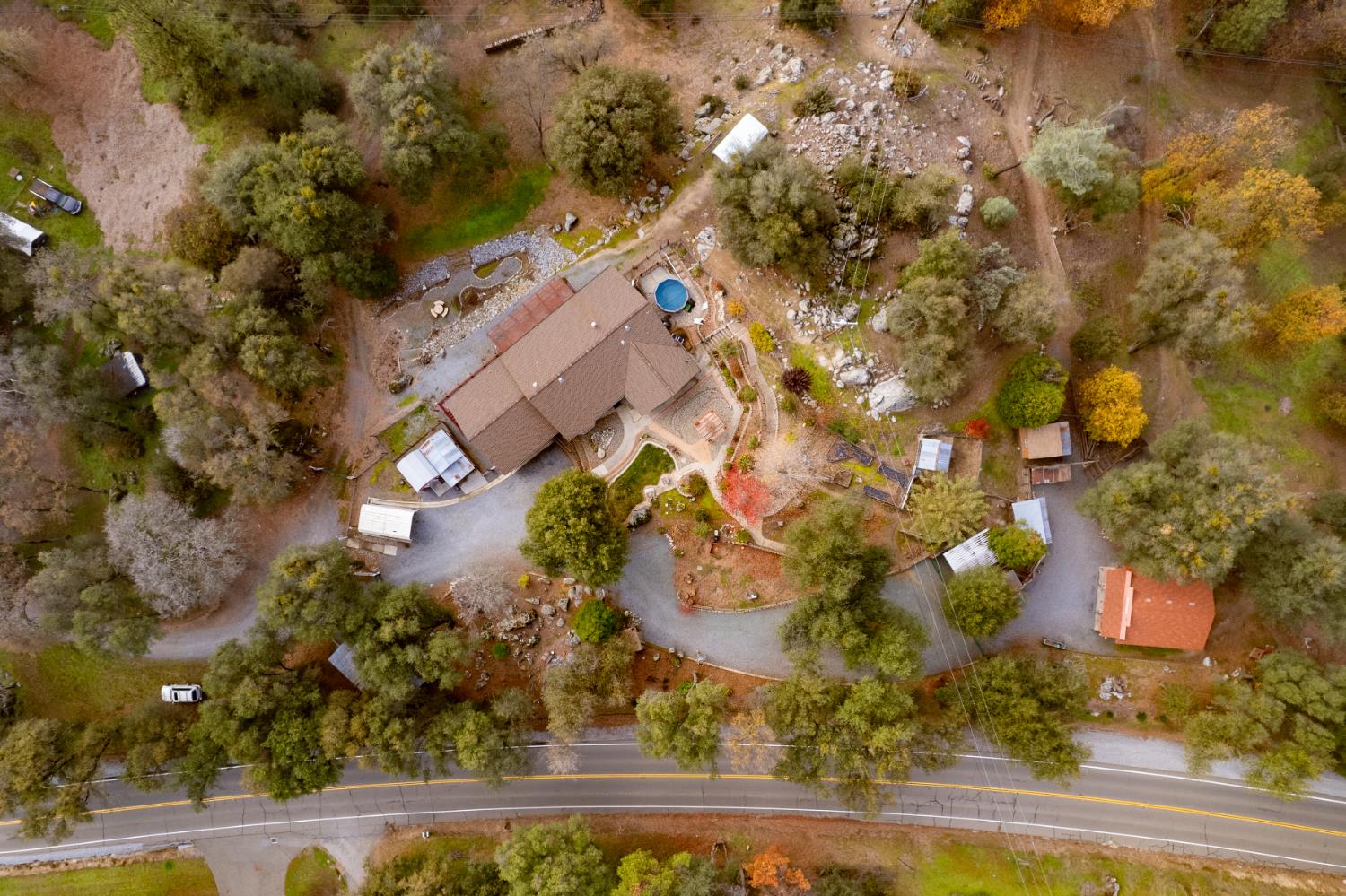 an aerial view of residential houses with yard