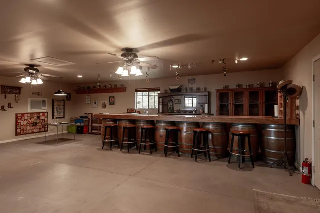 a living room with lots of furniture and a large window