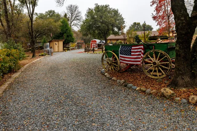 a kitchen with kitchen island a sink stainless steel appliances and cabinets