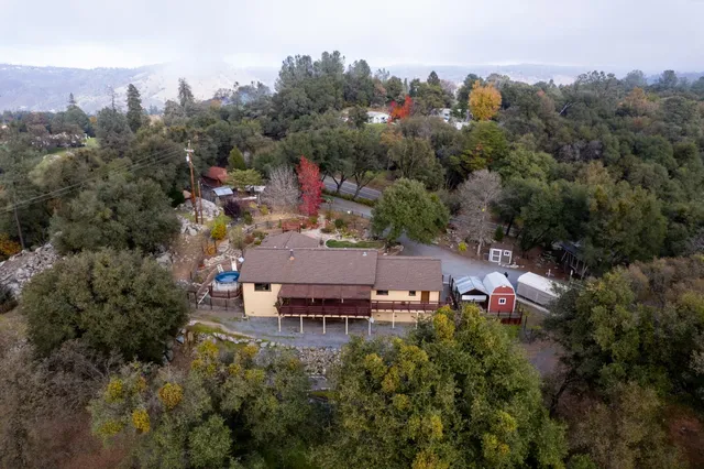 an aerial view of a house with a garden