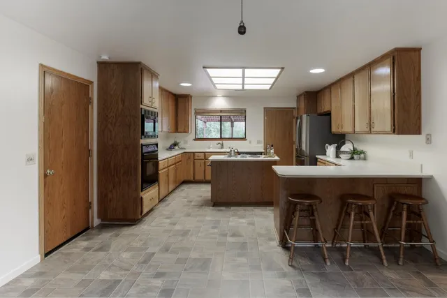 a view of an empty room with stairs