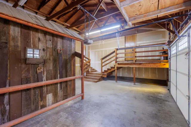 a view of a livingroom with a ceiling fan and window