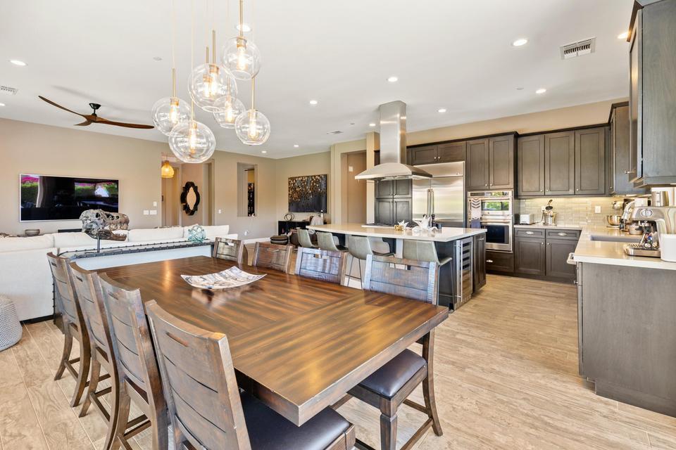 51790 South Two Palms Way Indio, CA 92201 - Photo 12 of 36 a large kitchen with a table and chairs