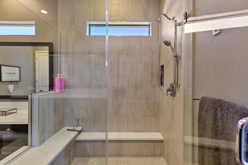 51790 South Two Palms Way Indio, CA 92201 - Photo 16 of 36 a bathroom with a shower and a glass door shower