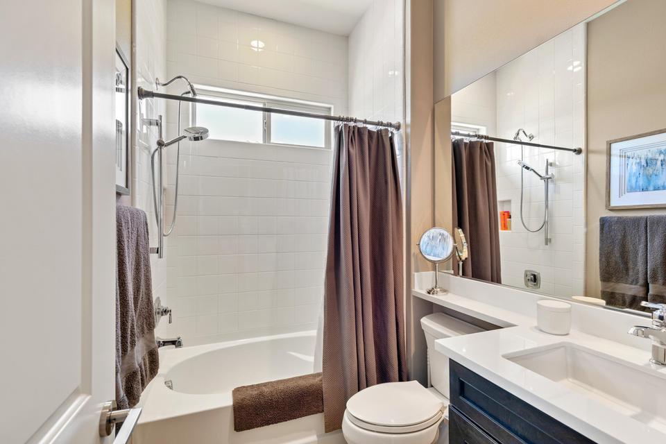 51790 South Two Palms Way Indio, CA 92201 - Photo 19 of 36 a bathroom with a sink toilet and shower