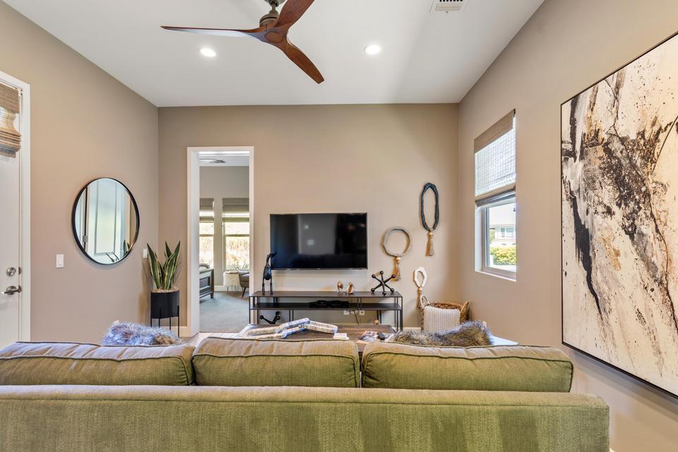 51790 South Two Palms Way Indio, CA 92201 - Photo 22 of 36 a living room with fireplace furniture and a flat screen tv