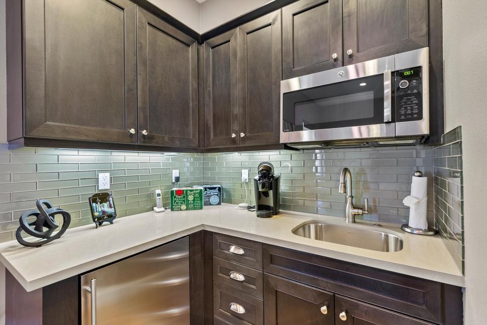 51790 South Two Palms Way Indio, CA 92201 - Photo 23 of 36 a kitchen with a sink a stove and cabinets