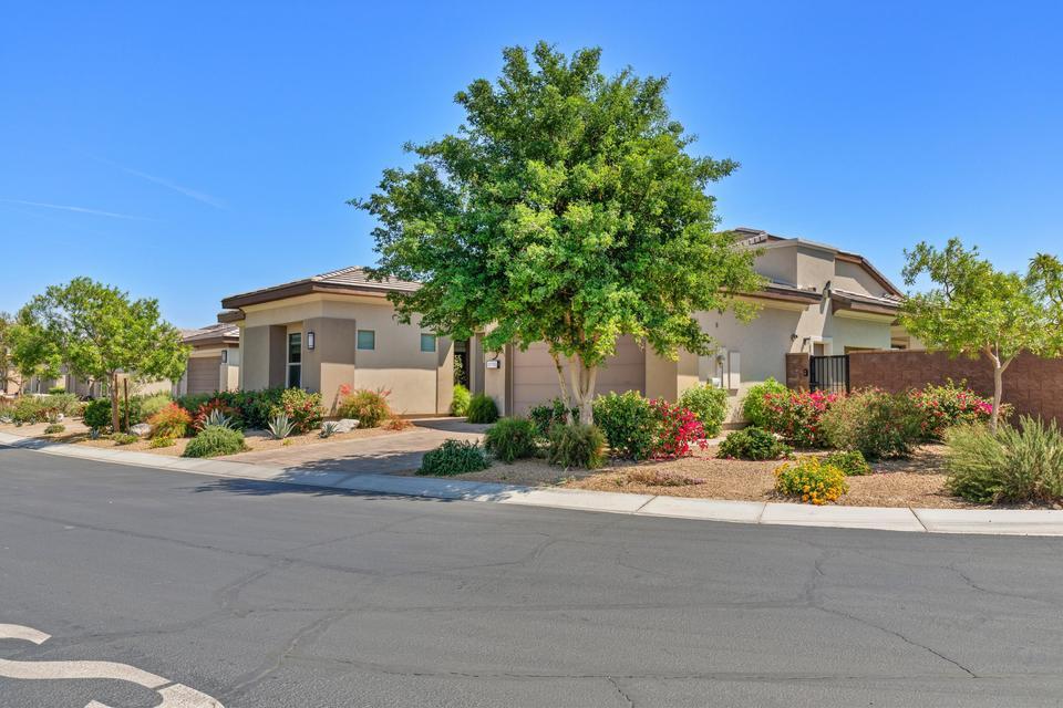 51790 South Two Palms Way Indio, CA 92201 - Photo 32 of 36 a front view of a house with a yard and a garage