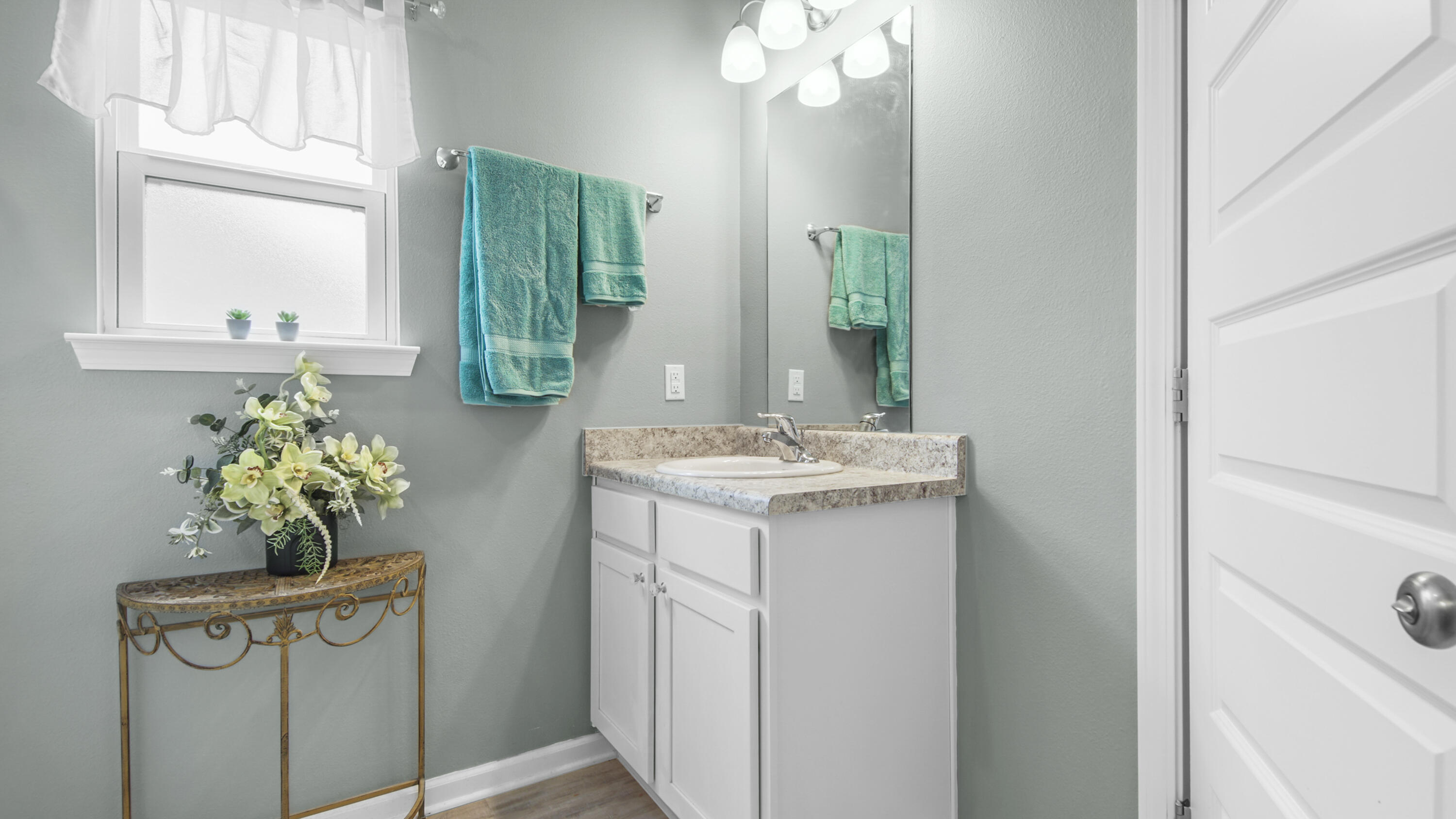 41 Woodsorrel Street Freeport, FL 32439 - Photo 11 of 41 a bathroom with a sink mirror and vanity