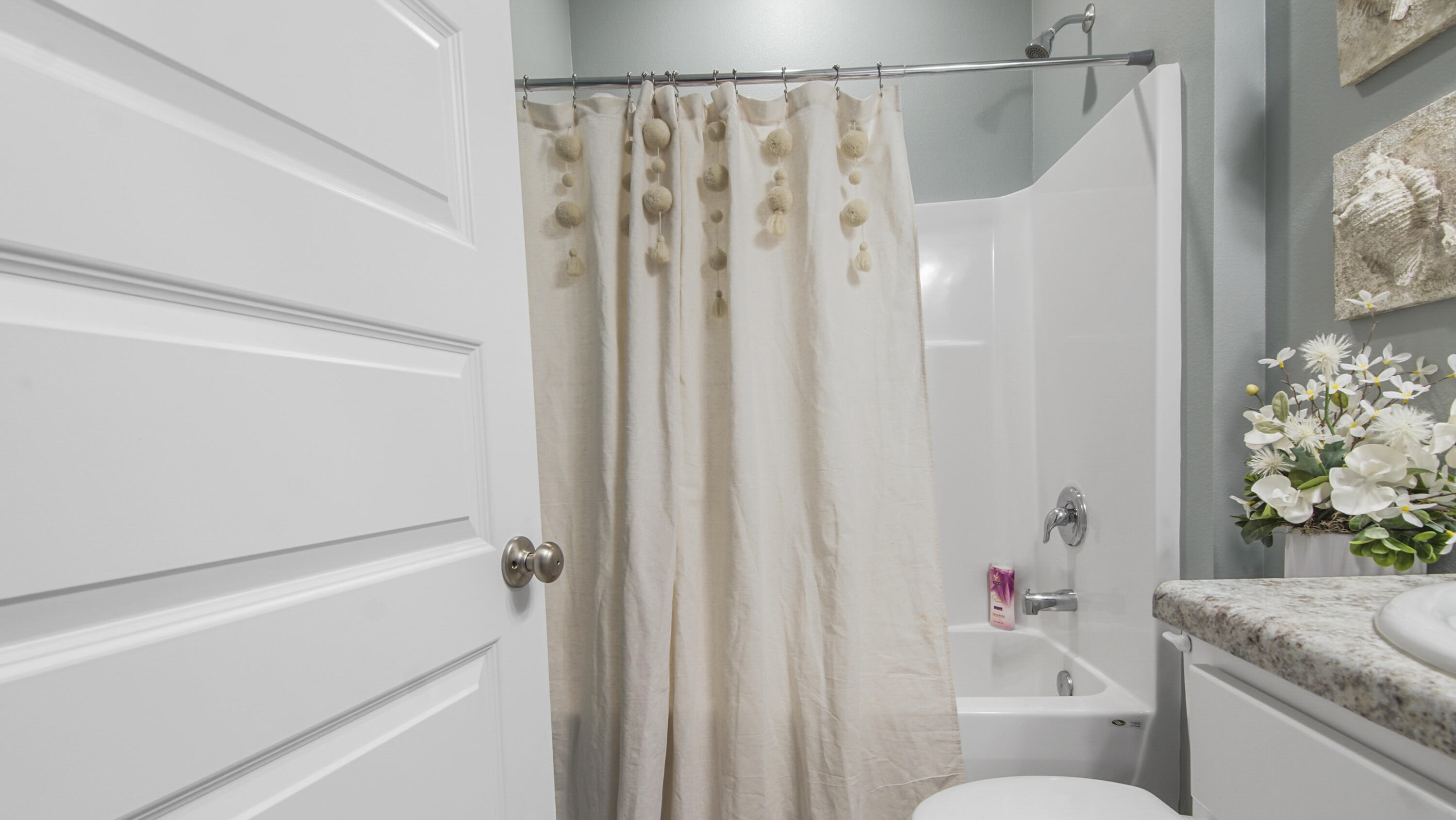41 Woodsorrel Street Freeport, FL 32439 - Photo 15 of 41 a bathroom with a shower curtain and a sink