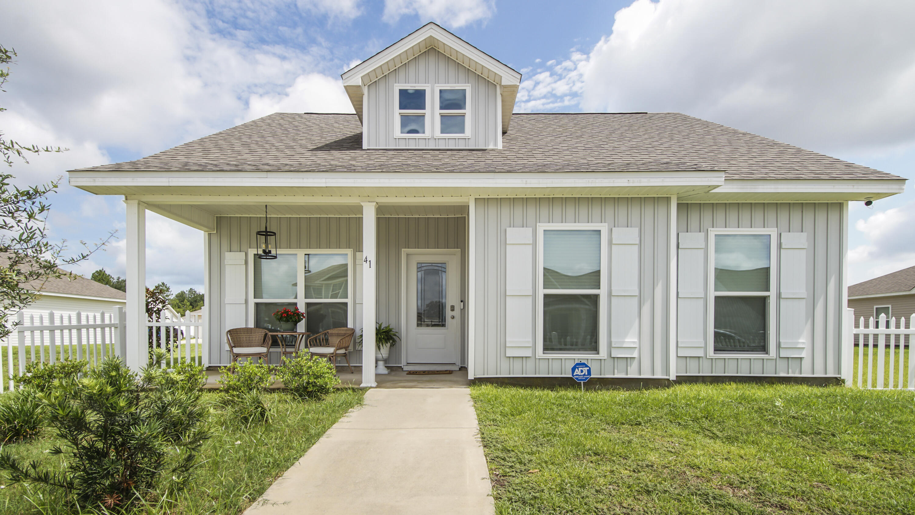 41 Woodsorrel Street Freeport, FL 32439 - Photo 2 of 41 a view of a house with garden