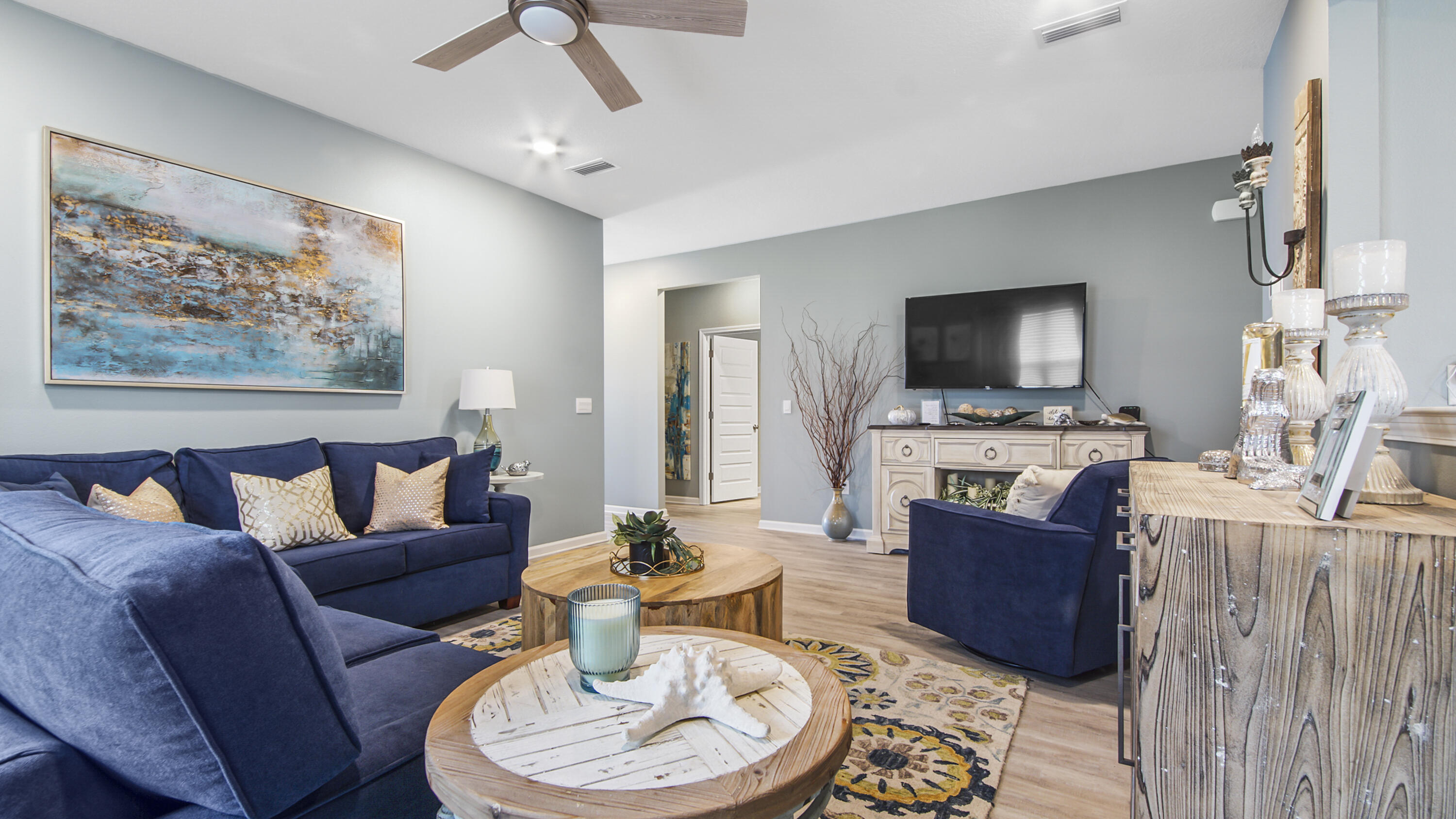 41 Woodsorrel Street Freeport, FL 32439 - Photo 23 of 41 a living room with furniture a fireplace and a flat screen tv