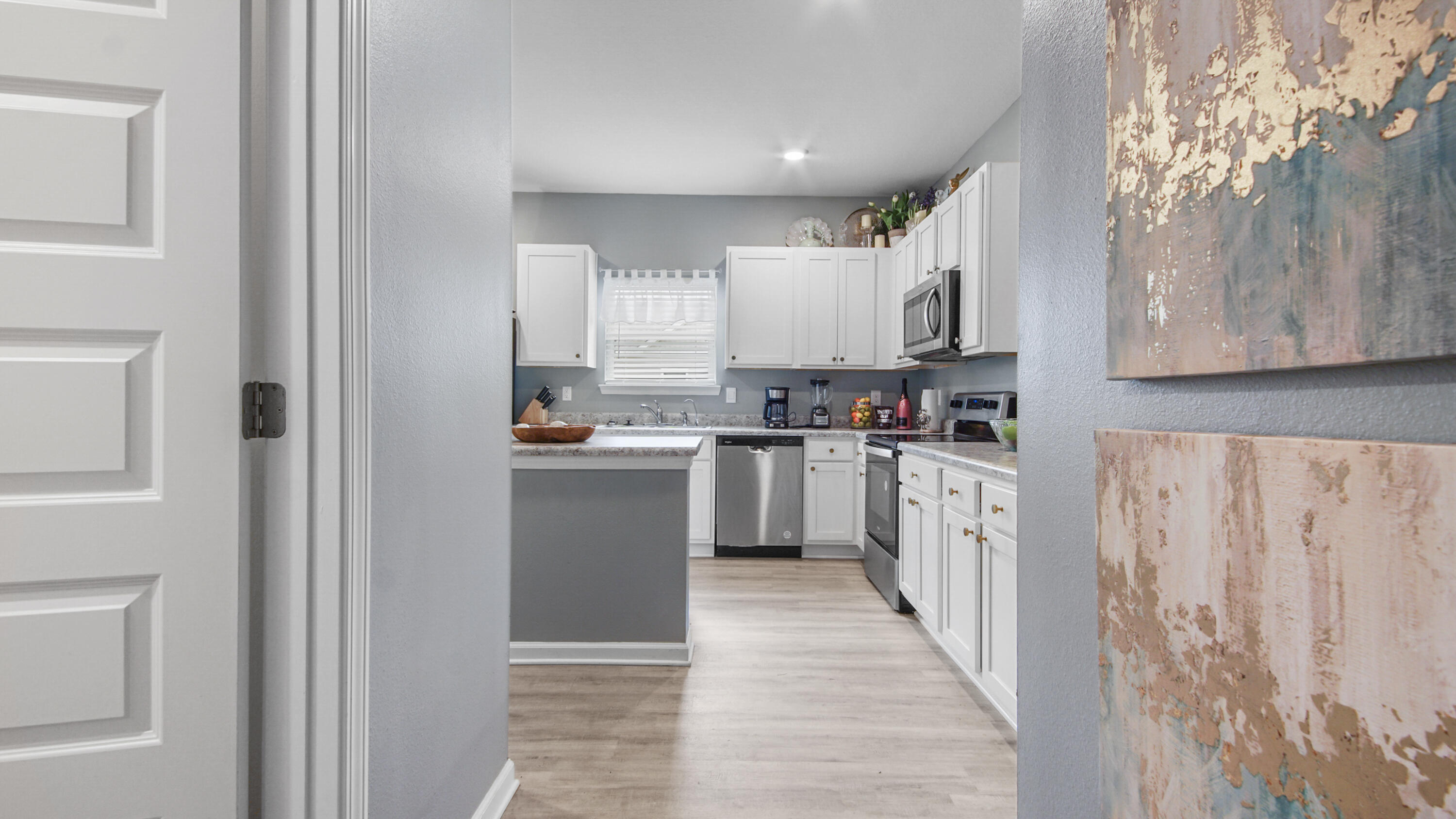 41 Woodsorrel Street Freeport, FL 32439 - Photo 29 of 41 a kitchen with cabinets and window