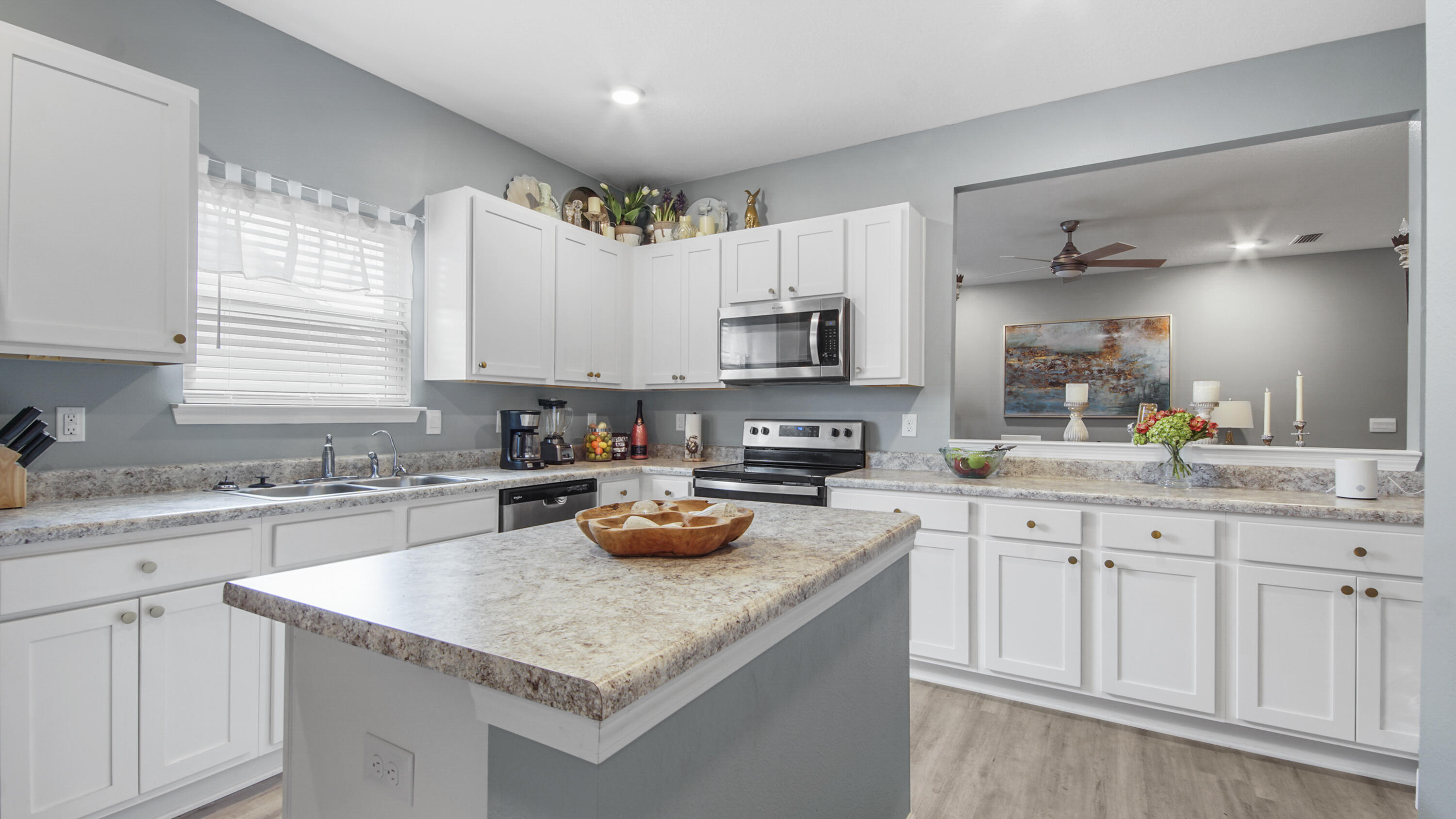 41 Woodsorrel Street Freeport, FL 32439 - Photo 32 of 41 a kitchen with sink a stove and cabinets