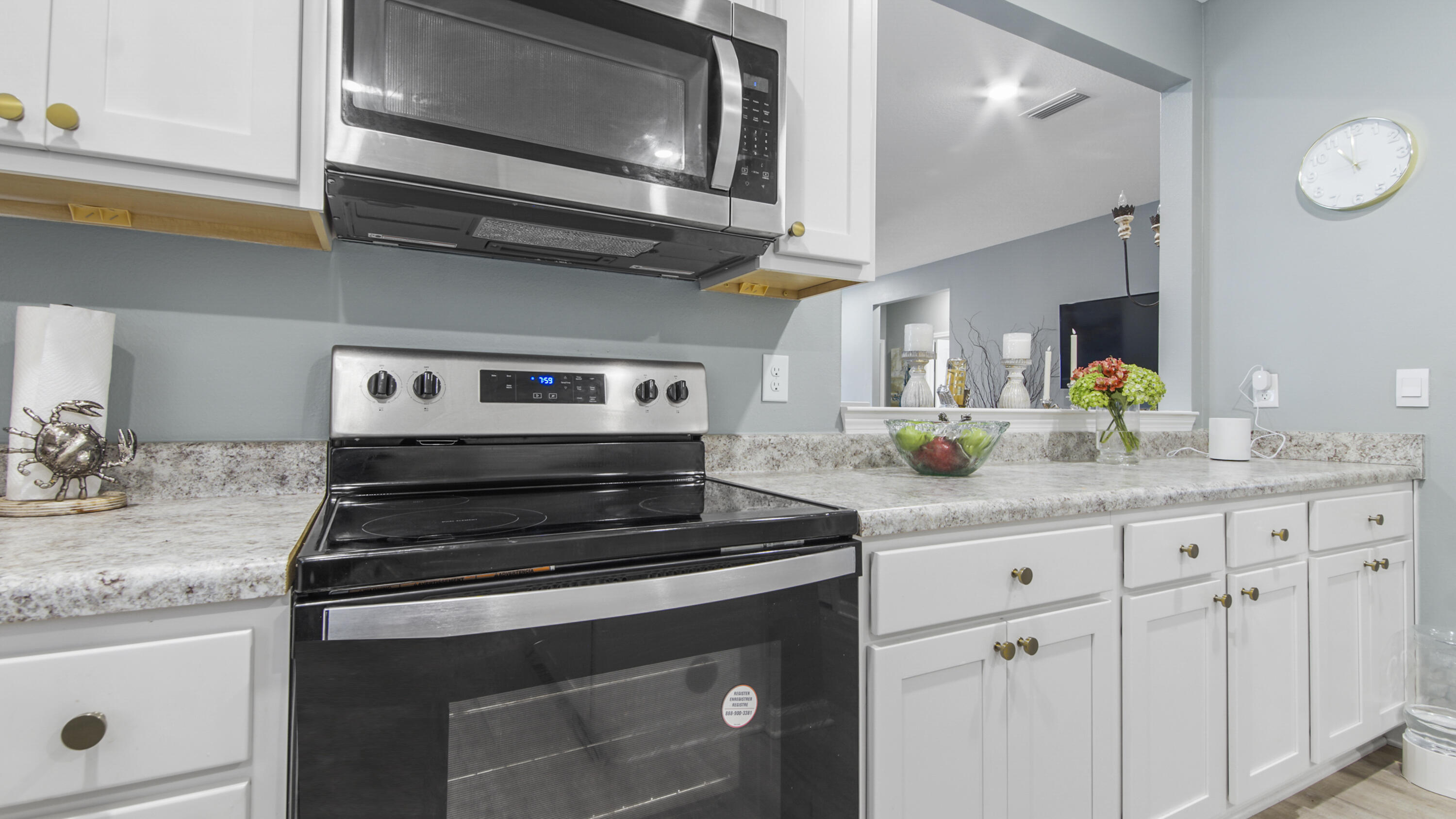 41 Woodsorrel Street Freeport, FL 32439 - Photo 34 of 41 a kitchen with granite countertop a stove and cabinets