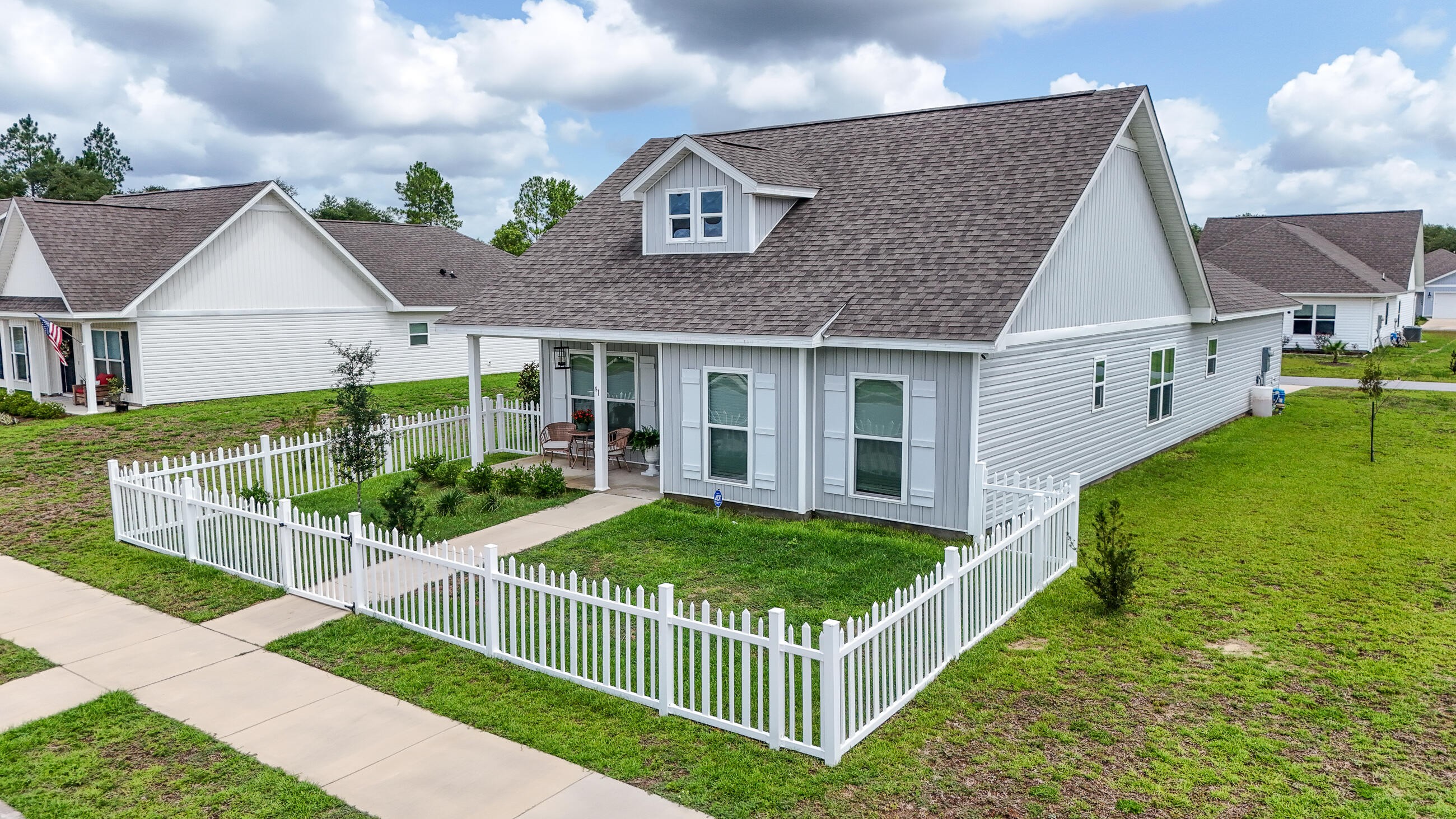 41 Woodsorrel Street Freeport, FL 32439 - Photo 39 of 41 a view of a house with backyard and porch
