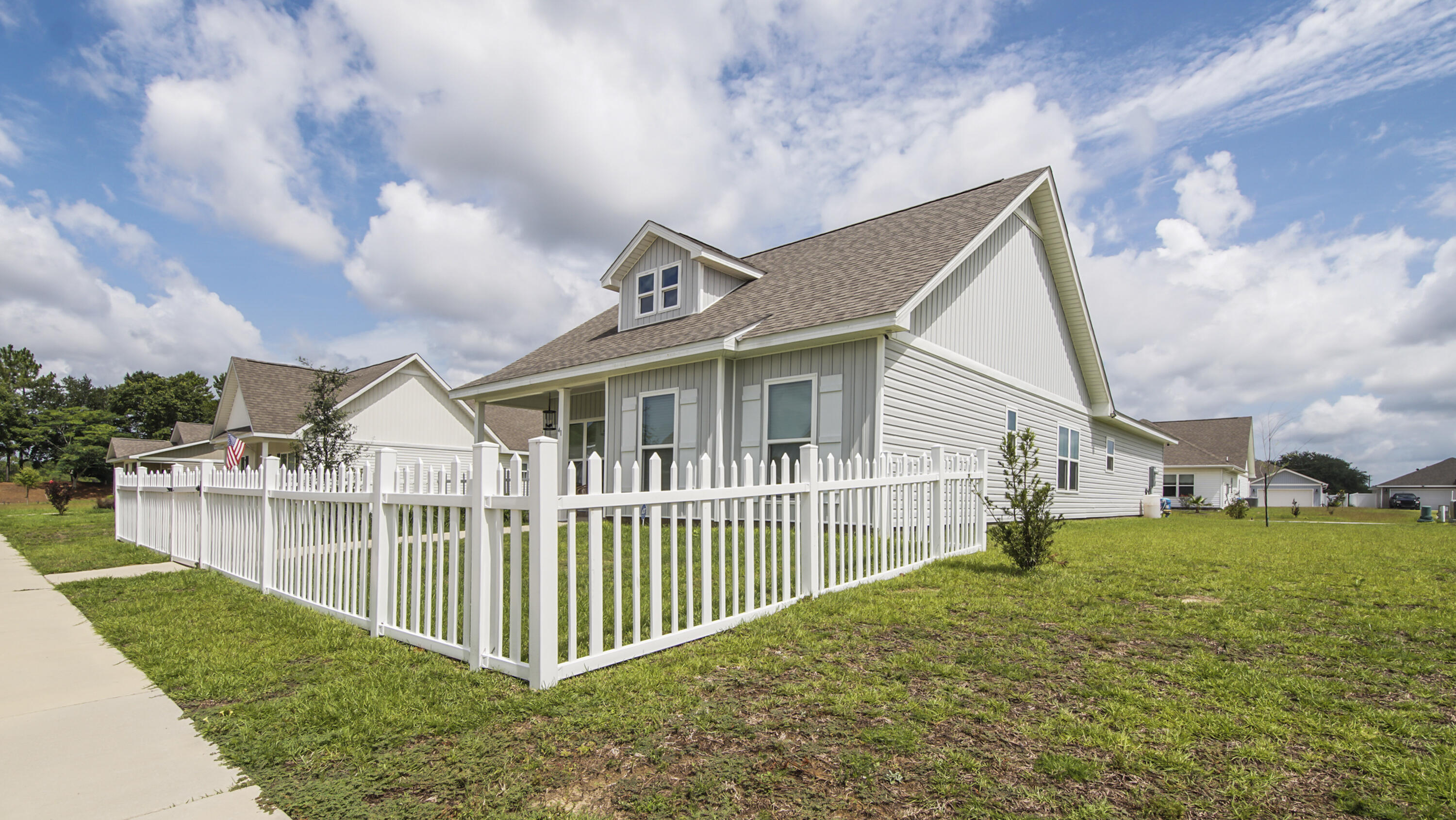 41 Woodsorrel Street Freeport, FL 32439 - Photo 40 of 41 a view of a house with a yard and sitting area