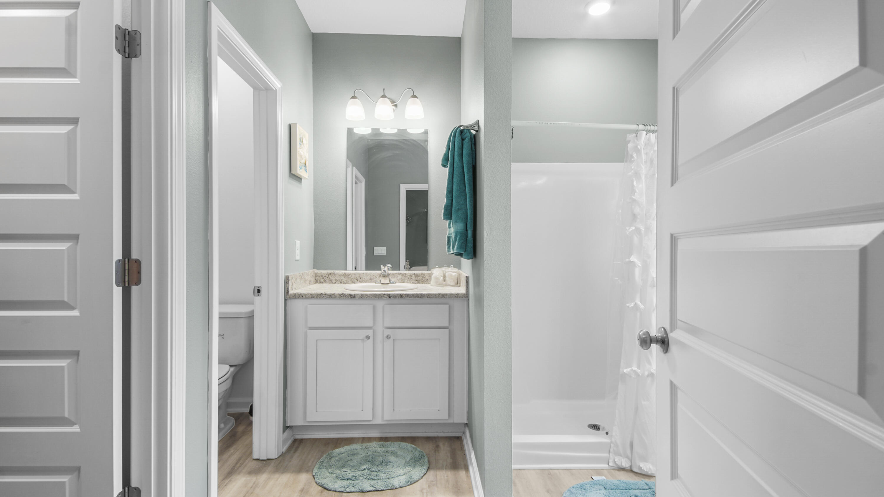 41 Woodsorrel Street Freeport, FL 32439 - Photo 9 of 41 a bathroom with a mirror and a shower