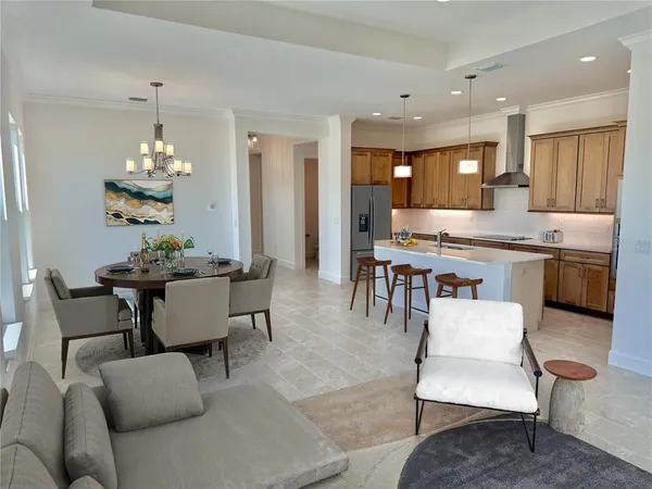 a large kitchen with kitchen island a large island in it