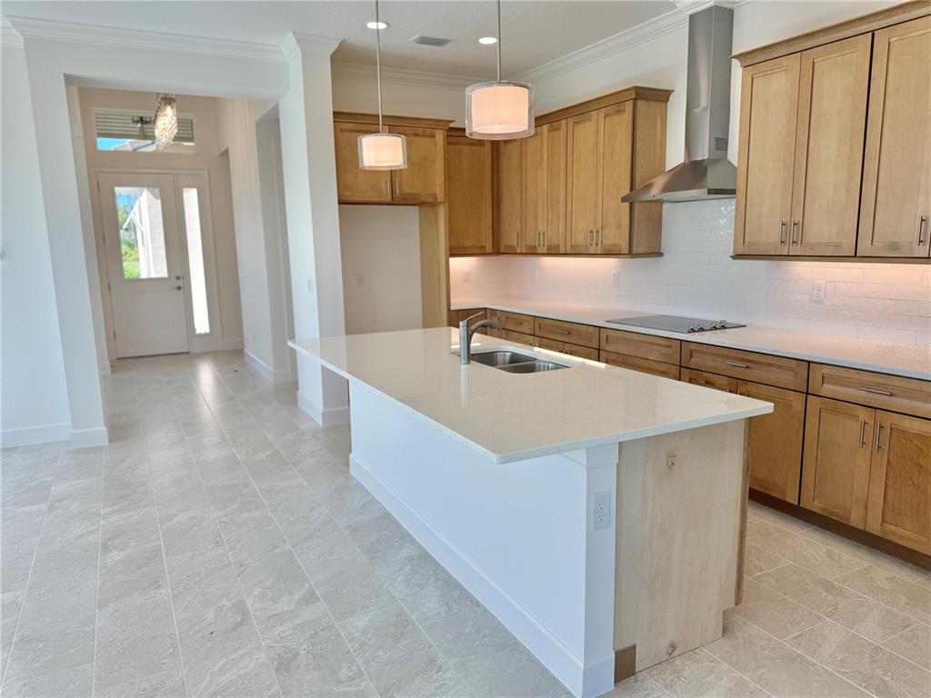 4 Coronado Road Flagler Beach, FL 32136 - Photo 23 of 63 a kitchen with stainless steel appliances granite countertop a sink a stove and a refrigerator