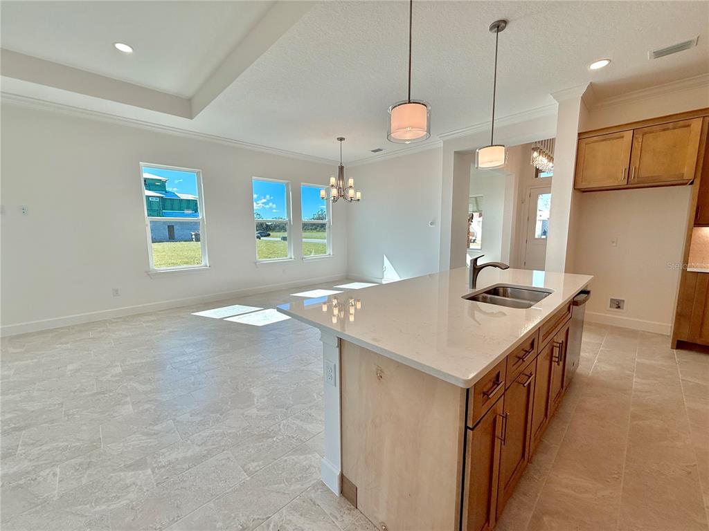 4 Coronado Road Flagler Beach, FL 32136 - Photo 24 of 63 a kitchen with kitchen island a sink stove and refrigerator