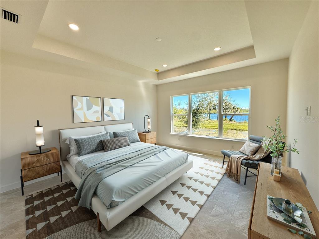 4 Coronado Road Flagler Beach, FL 32136 - Photo 39 of 63 a bedroom with a large bed and a couch