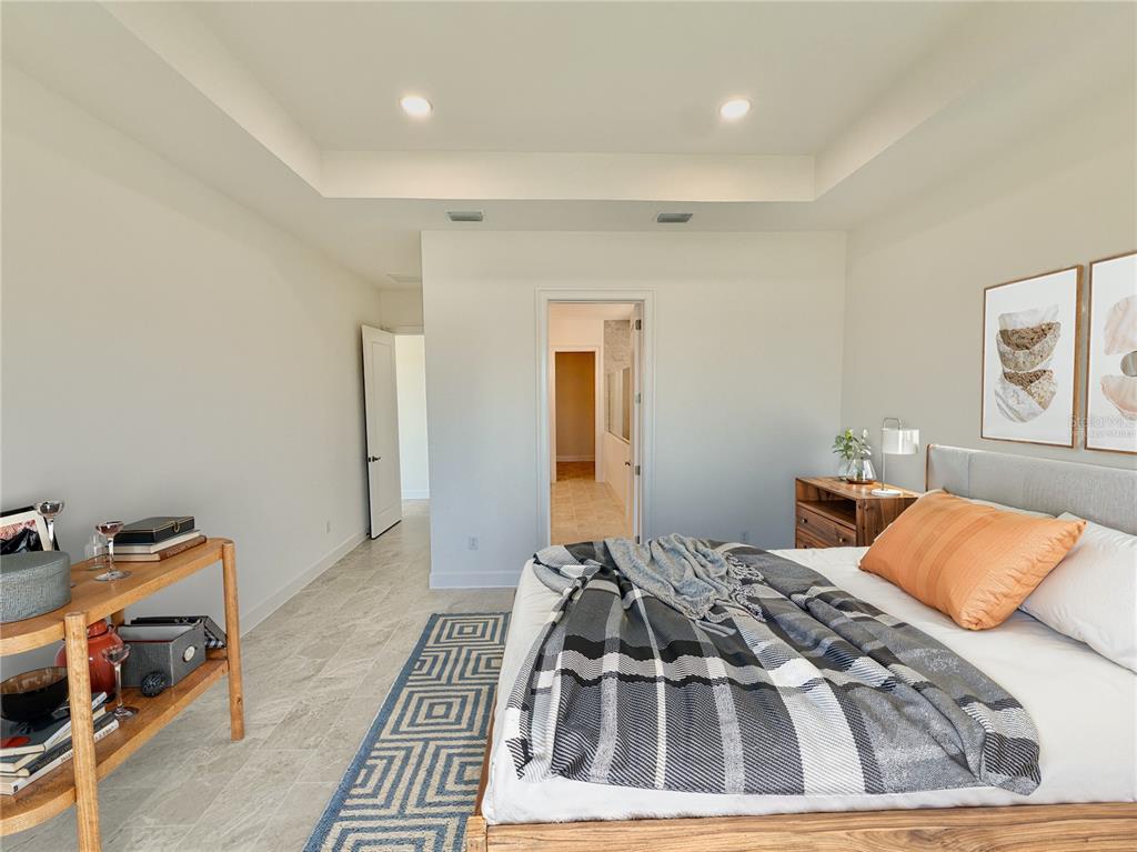 4 Coronado Road Flagler Beach, FL 32136 - Photo 41 of 63 a bedroom with a bed and wooden floor