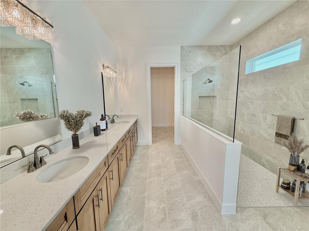 4 Coronado Road Flagler Beach, FL 32136 - Photo 45 of 63 a bathroom with double vanity sink and a mirror