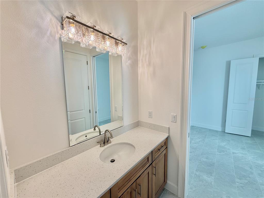 4 Coronado Road Flagler Beach, FL 32136 - Photo 55 of 63 a bathroom with a sink and a mirror