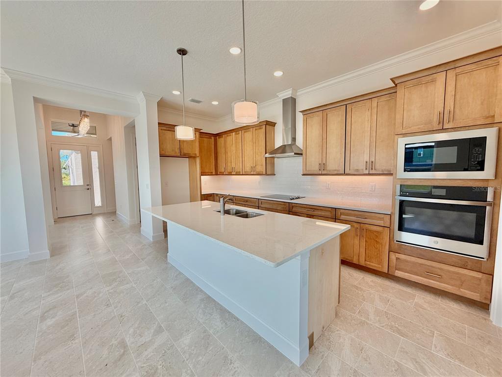 4 Coronado Road Flagler Beach, FL 32136 - Photo 8 of 63 a large kitchen with a stove and a sink