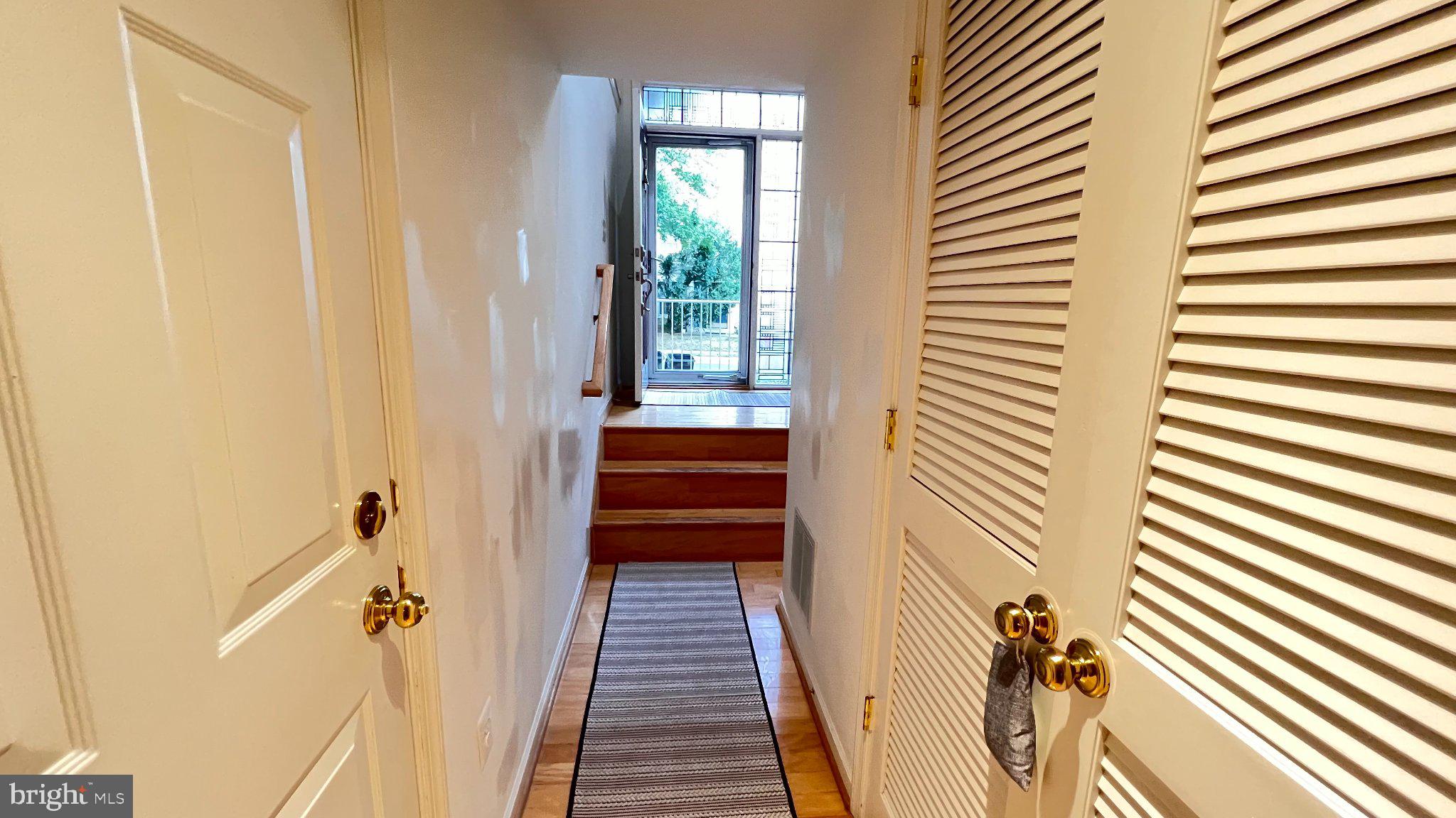 4100 Flower Fairfax, VA 22030 - Photo 4 of 47 a view of a hallway with wooden floor and staircase